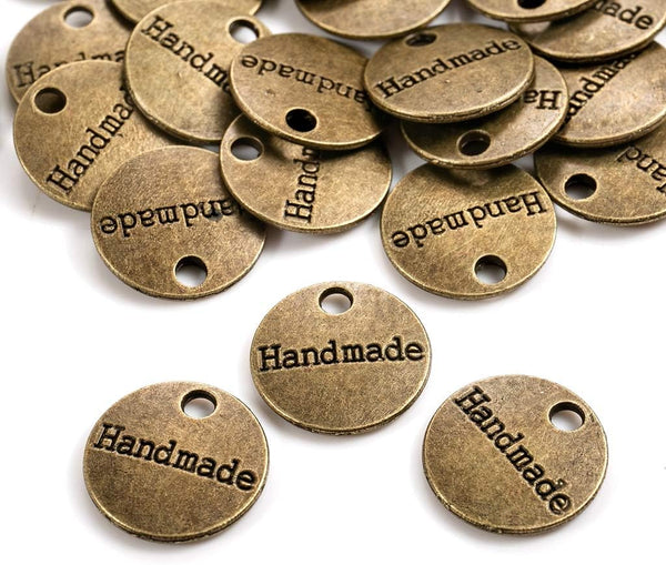 Dopofrance in bronzo circolare con scritta Handmade per Bottone HANDMADE In Metallo